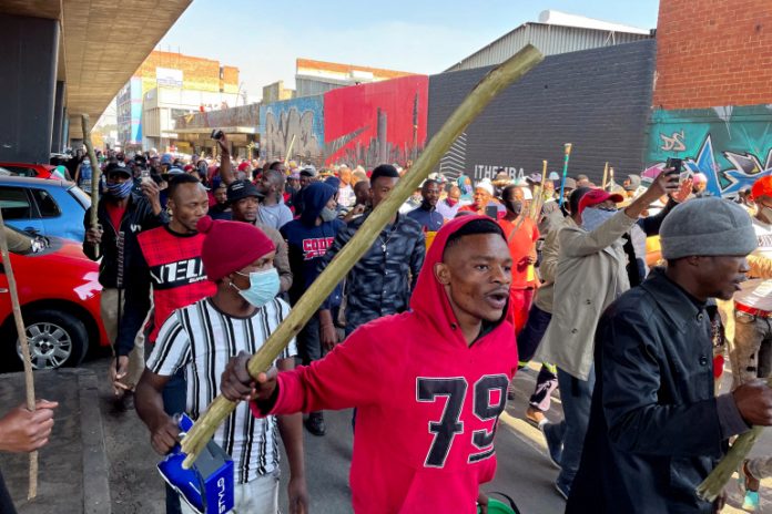 Violence spreads to South Africa's economic hub in wake of Zuma jailing, in Johannesburg