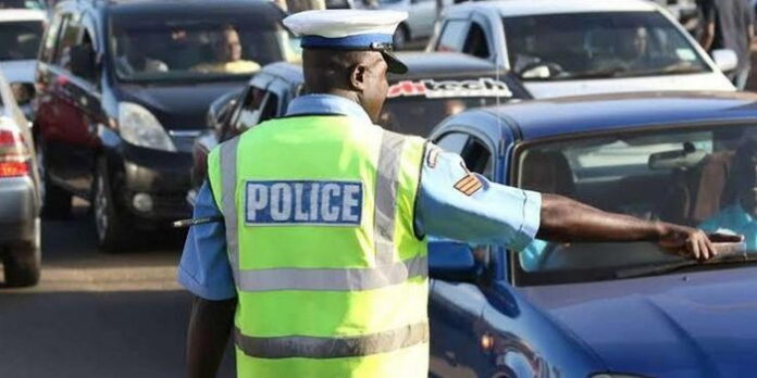 An image of a traffic police officer manning traffic on a road in Nairobi