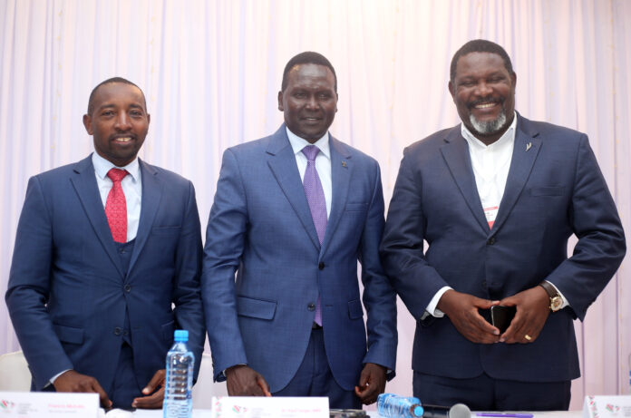 National-Olympics-Committee-of-Kenya-President-Paul-Tergat-with-Secretary-General-Francis-Mutuku-and-1st-Vice-President-Shadrack-Maluki-RIGHT-during-AGM-Caps-scaled