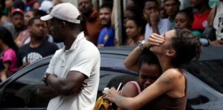 Corpses line Rio street, pushing death toll from police raids to 132