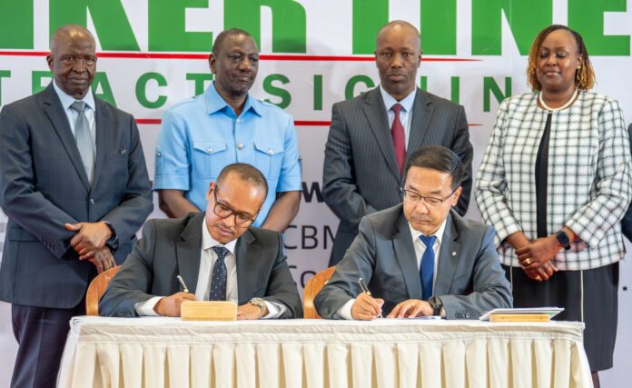 Amsons-Group-Managing-Director-Mr-Edha-Nahdi-left-and-Sinoma-CBMI-Chairman-Mr-Zhang-Sicai-signing-the-US250-million-Matuga-Clinker-Factory-Construction-contract-2048x1257