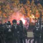 Police chase fans off the field in clashes at German club game in Dresden