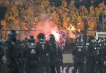 Police chase fans off the field in clashes at German club game in Dresden