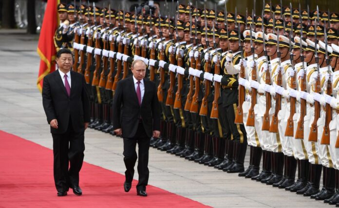180608171122-01-xi-jinping-vladimir-putin-june